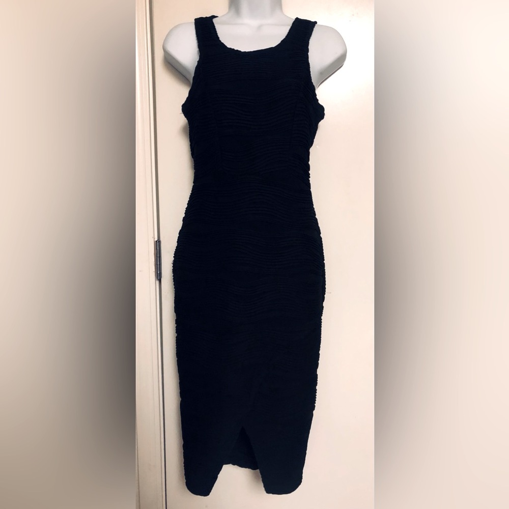 BRAT STAR - Black body-con form fitting textured black dress.